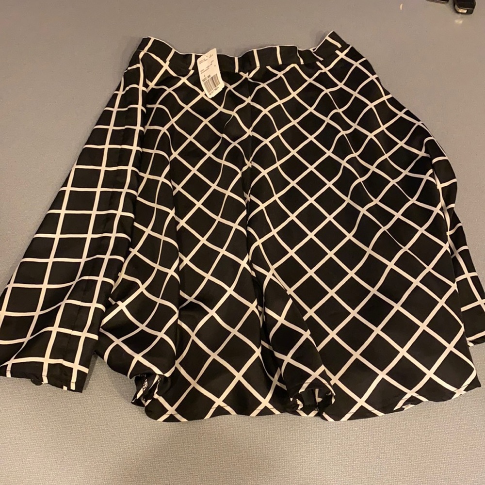 Black and white mid knee skirt. Never worn